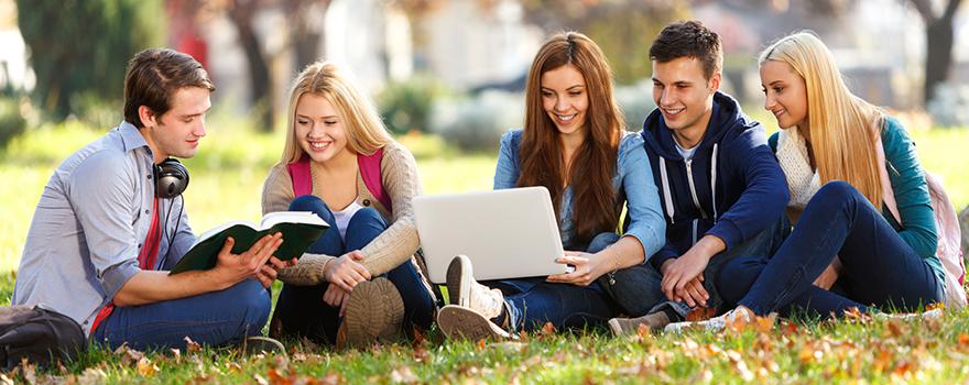 Group of college students studying at campus